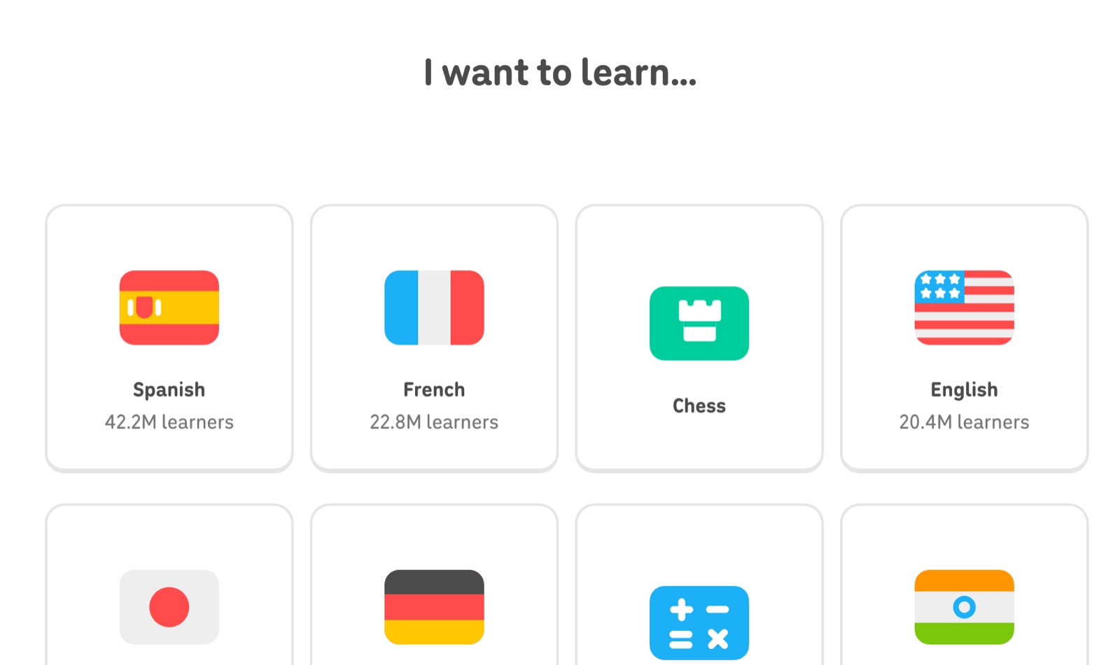 Экран Duolingo «I want to learn...» с карточками курсов: испанский, французский, шахматы, английский